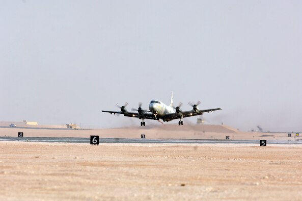 A Navy P-3, with the Patrol Squadron EIGHT, takes off from Southwest Asia. Orignally designed for anti-submarine warfare, the Commander, Task Group 57.2 uses the plane in the area of responsibility for ground surveillance. 