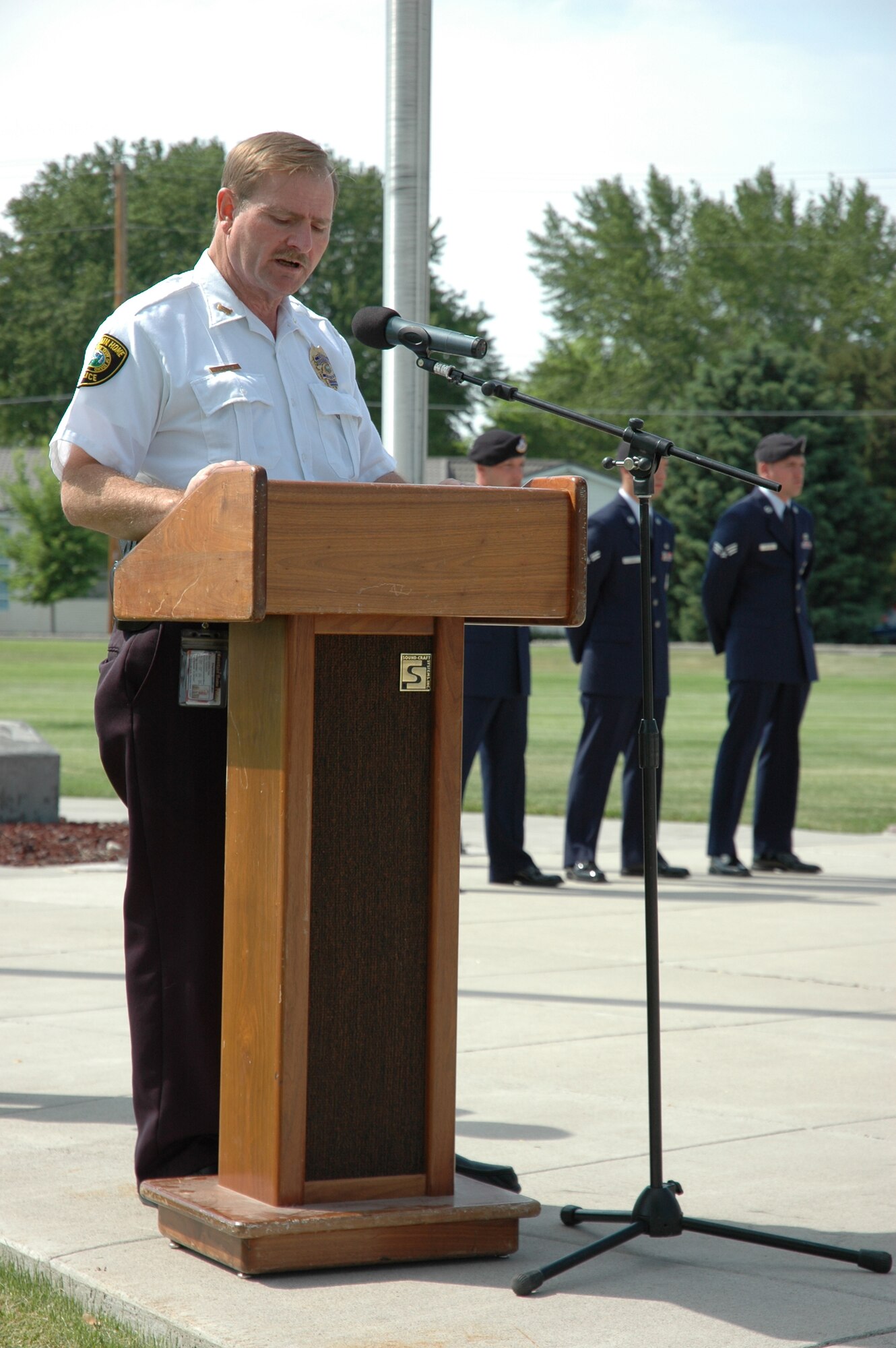 MOUNTAIN HOME AIR FORCE BASE, Idaho -- Police Chief Tom Berry from the Mountain Home Police Departement speaks to base security forces troops, members of the city's police department and guests at a formal retreat ceremony at Holt Park here May 18. The ceremony concluded the base's National Police Week observance. (U.S. Air Force photo/Airman Samantha S. DeVries)