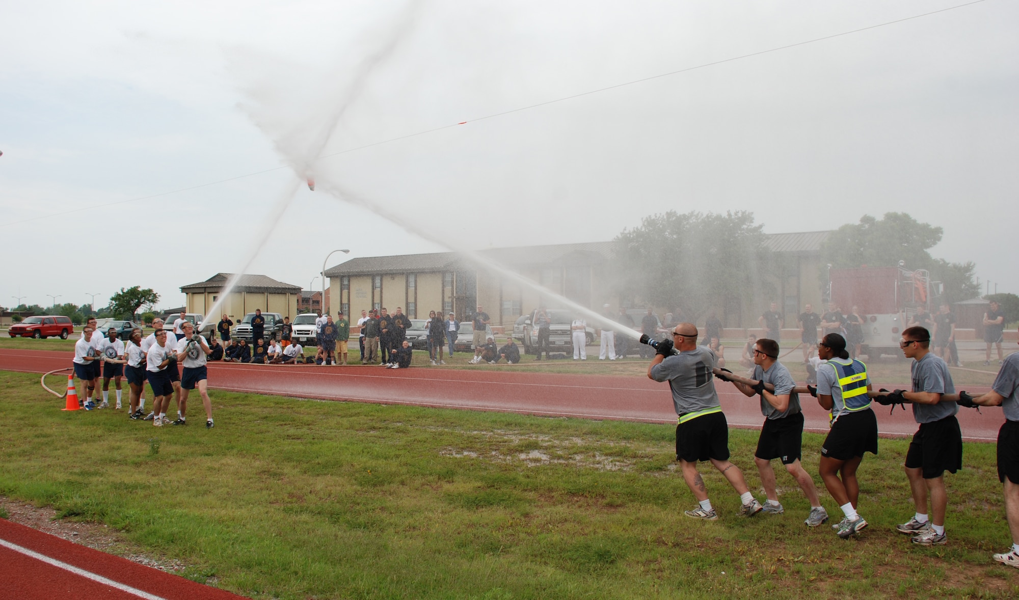 Members of the Army and Navy teams face off during the fireman's hose tug-of-war at the Joint Warrior Challenge May 19. (U.S. Air Force photo/Airman 1st Class Jacob Corbin)