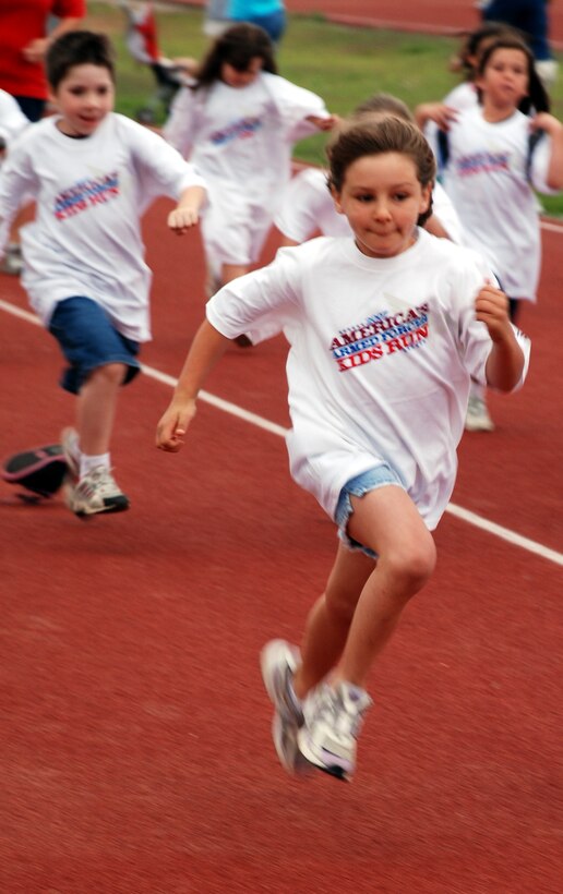 Ciara Parkhursd, daughter of Tech. Sgt. Mike Rinnels, 82nd Dental Squadron, and Tech. Sgt. Jennifer Rinnels, 381st Training Squadron, runs at the Armed Forces Day America's Kids Run May 19. (U.S. Air Force photo/Airman 1st Class Jacob Corbin)