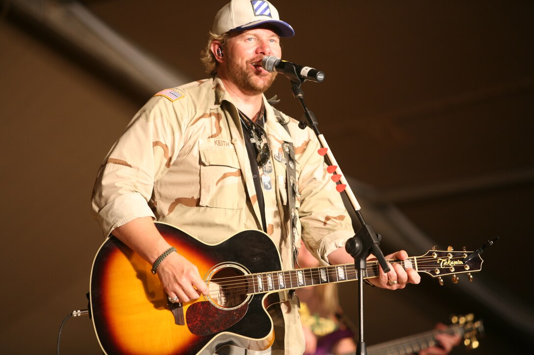 Country music star Toby Keith performs one of his hit singles during a concert held at the Al Asad stadium, May 25. Keith also signed autographs and took photos with a group of service members before the concert.