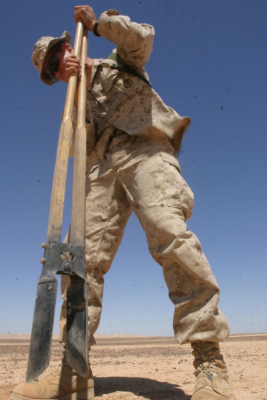 Lance Cpl. Andrew D. Pearson, a combat engineer from Combat Engineer Platoon, Battalion Landing Team 2/2, 26th Marine Expeditionary Unit, digs a hole to emplace targets at a range in the Middle East, May 23, 2007.  The engineers were conducting live-fire demolition training alongside regional forces.  (Official USMC photo by Cpl. Jeremy Ross) (Released)