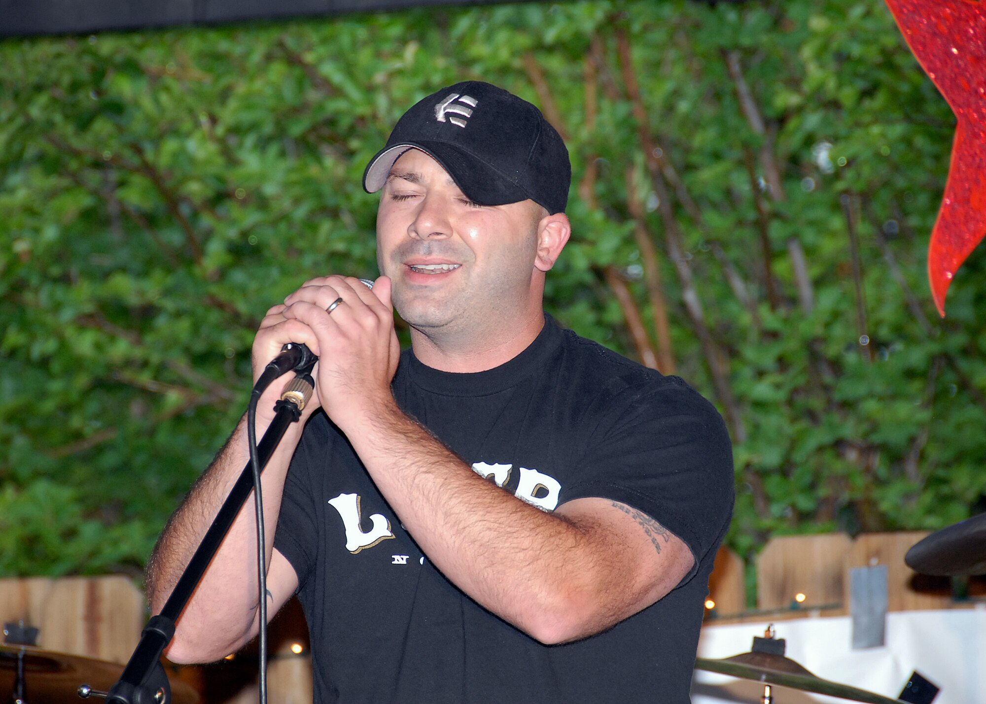 Staff Sgt. Marc West of the 360th Training Squadron performs as one of the five finalists in the Sheppard Idol competition at the Sheppard Club May 18. (U.S. Air Force photo/Mike Litteken.)