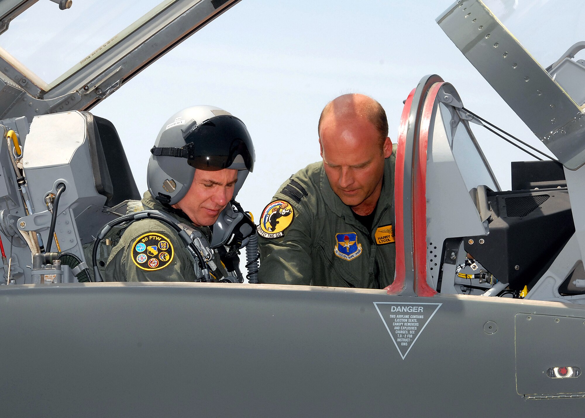 Lt. Col. Harry Oostema of the 90th Flight Training Wing reviews the new T-38C Talon features with 82nd Training Wing Commander Brig. Gen. Richard Devereaux before the general's flight May 17. (U.S. Air Force photo/Mike Litteken)