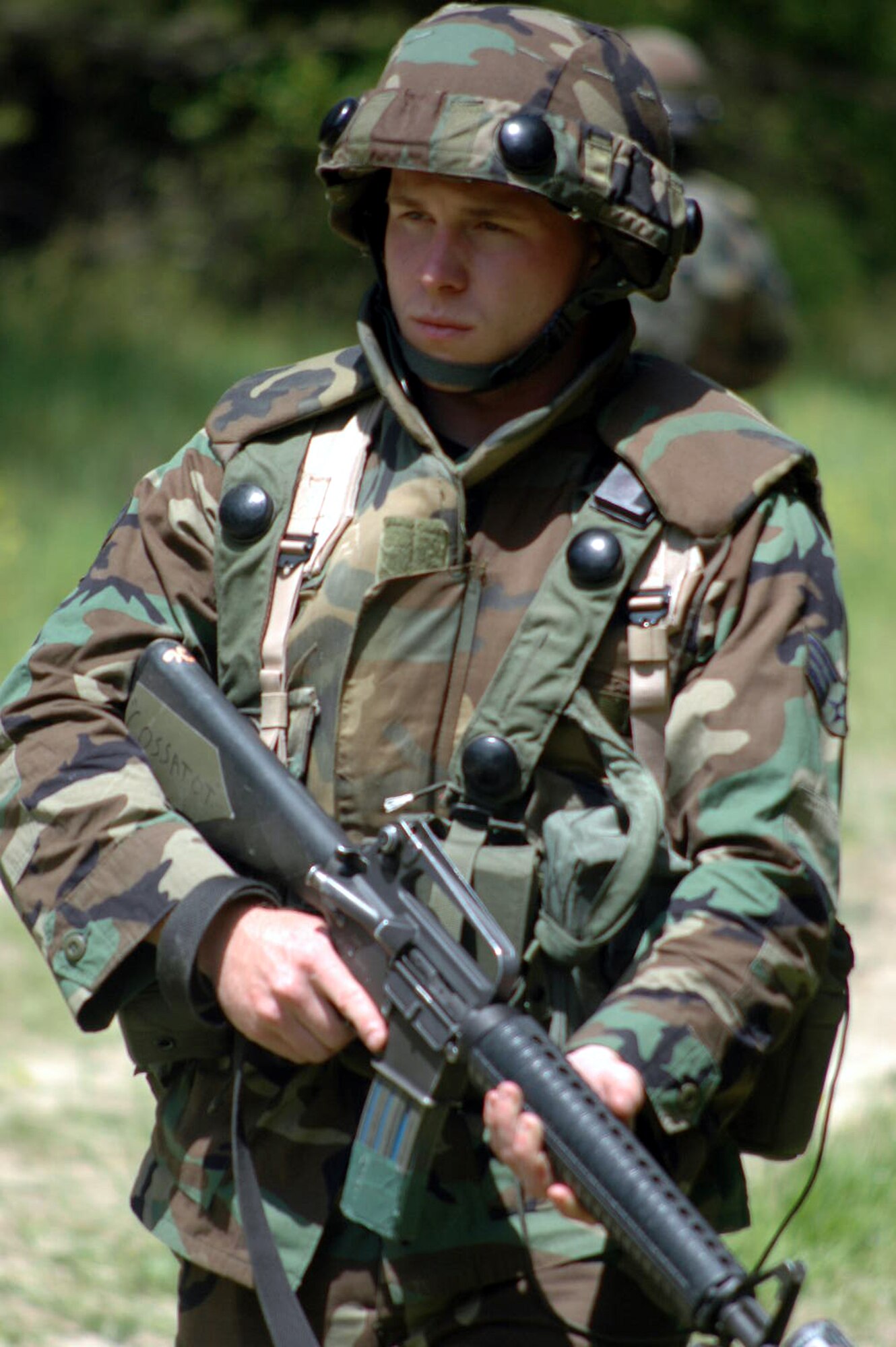 A U.S. Air Force senior airman practices patrolling as a member of a squad during a patrolling and tactics class for the Air Force Advanced Contingency Skills Training Course 07-2C May 14, 2007, at Fort Dix, N.J.  The course, taught by the U.S. Air Force Expeditionary Center's 421st Combat Training Squadron, prepares Airmen for upcoming deployments in a variety of combat skills.  (U.S. Air Force Photo by Tech. Sgt. Scott T. Sturkol)