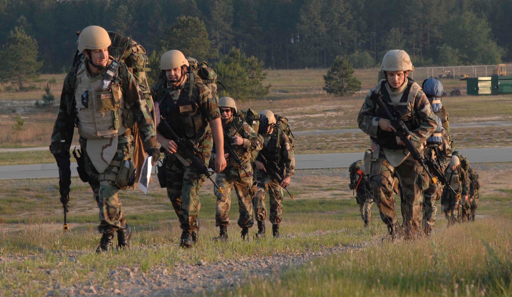 SHAW AIR FORCE BASE, S.C. -- Members of the 20th Civil Engineer Squadron Explosive Ordinance Disposal Flight marched up a hill during a three-mile hike to a simulated deployed location May 21. The U.S. Air Force recently made the field training exercise a mandatory requirement for all Civil Engineering Squadrons. As part the four-day FTX the 20th CES trained in self-aid buddy care, cardiopulmonary resuscitation, weapons safety, decontamination, security, land navigation, night operations and any job-specific training required.  (U.S. Air Force photo by Airman First Class Kathrine McDowell)