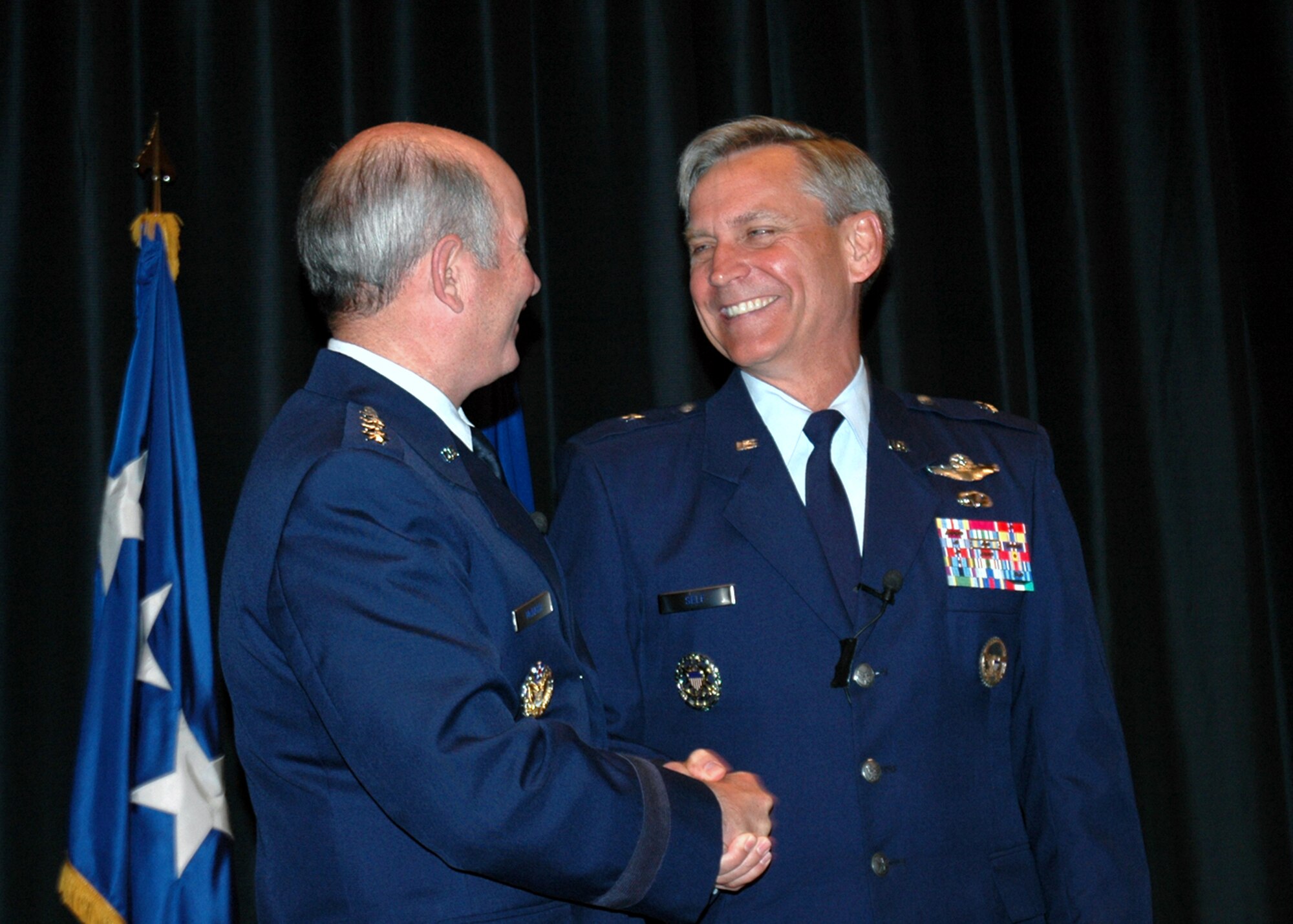 U.S. Air Force Gen. Duncan McNabb, commander of Air Mobility Command, congratulates Brig. Gen. Kip Self, U.S. Air Force Expeditionary Center Commander, during a change of command ceremony May 23, 2007, at the Center on Fort Dix, N.J., where General Self took the reigns of command.  (U.S. Air Force Photo/Tech. Sgt. Malinda Julian)