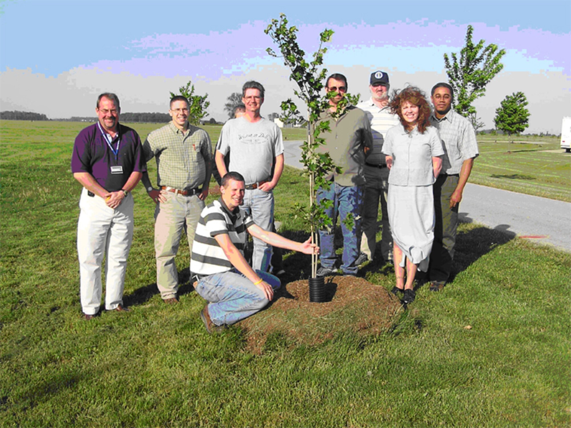 GRISSOM AIR RESERVE BASE, Ind -- Civil engineers from Grissom are helping the base live up to its "Tree City" designation.  Recently, 100 red maple trees were planted at various locations on base.  Assisting in the project were (left to right) Jeff Woodring, Sam Pier, Cory Walters, Steve Krawczyk, Gerry Dunica, Bryon Kelly, Amy Gilbert and Wayne Raby. (U.S. Air Force photo)