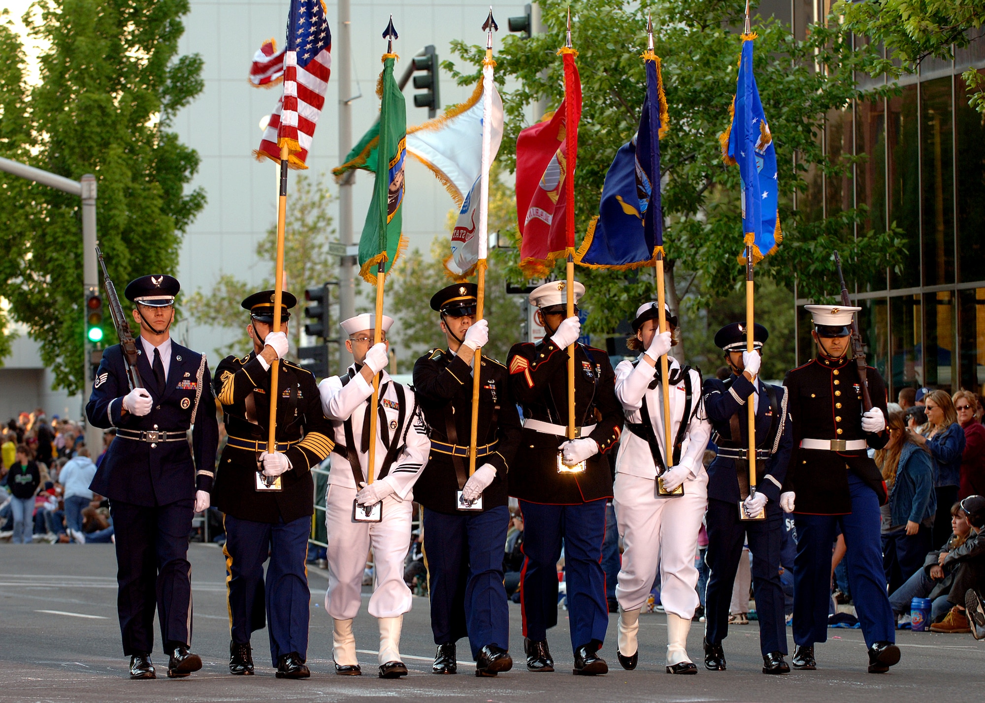 FAIRCHILD AIR FORCE BASE, Wash. – Armed Forces servicemembers carry the flags during the Lilac Festival Armed Forces Torchlight Parade in Spokane May 19. (U.S. Air Force photo/Airman 1st Class Joshua Chapman)
