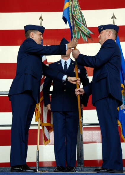 Colonel John C. Valle assumes command of the 7th Operations Group at a change of command ceremony on May 22, 2007 at Dyess AFB, Texas. Colonel Timothy Ray is the Officiating Officer of the Ceremony. (U.S. Air Force photo/Airman Stephen Reyes)