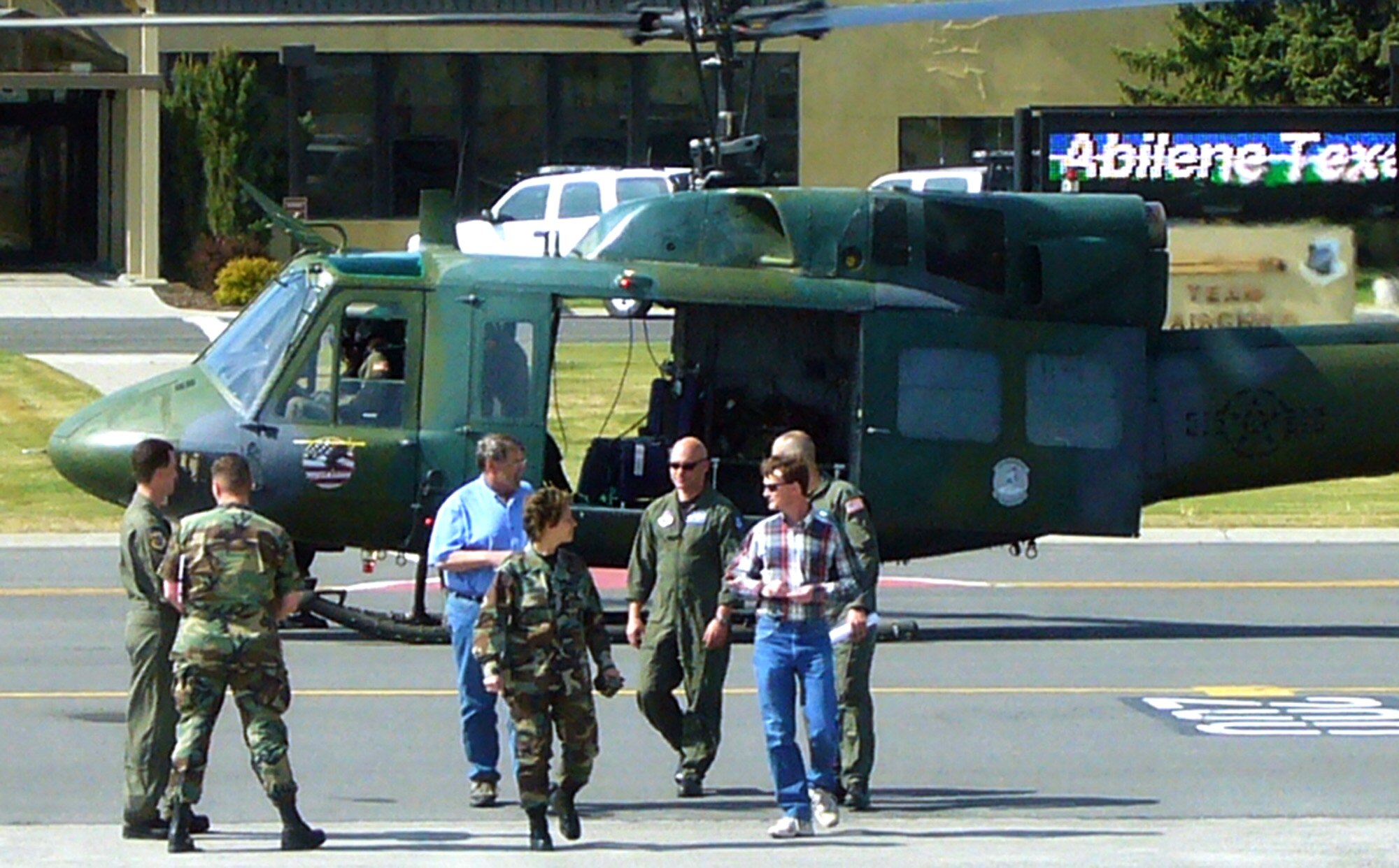 FAIRCHILD AIR FORCE BASE, Wash. – A small contingent of Fairchild personnel and visitors from the Abilene Texas Chamber of Commerce enjoy a helicopter flight as part of a Fairchild base tour May 17. Dr. James Webster and Gray Bridwell traveled to Fairchild for a tour and presented the Abilene Trophy to the City of Spokane the following day. The Greater Spokane Regional Chamber of Commerce and the City of Spokane were recently selected as the 2006 winner of the Abilene Trophy, which recognizes the community which provides the finest support to an Air Mobility Command installation.  (U.S. Air Force photo/Lt. Col. Jeffrey Neuberger)