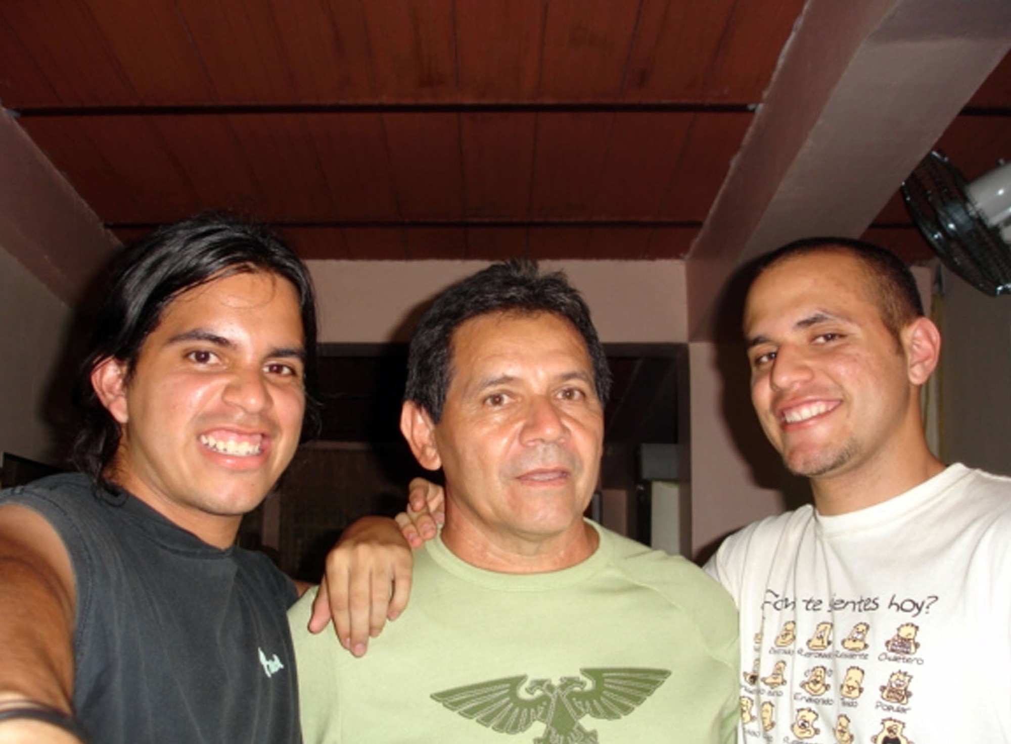 Pictured July 2006, Airman 1st Class Edward Camacho (right) is all smiles following a surprise visit to his family home in Guacara, Venezuela. Two years earlier, his father Juan Vicente, (pictured in middle) gave Edward a one-way ticket and his entire 30-year pension in hopes the young man's dream of becoming an Air Force officer, pilot and ultimately an astronaut, might one day be fulfilled. The supply troop deployed from Aviano Air Base, Italy, to Balad AB's 332nd Expeditionary Logistical Readiness Squadron in Iraq, recently learned he was selected for the Air Force Academy's Preparatory School in Colorado. Pictured on left is Edward's brother, Bryant. (U.S. Air Force photo)