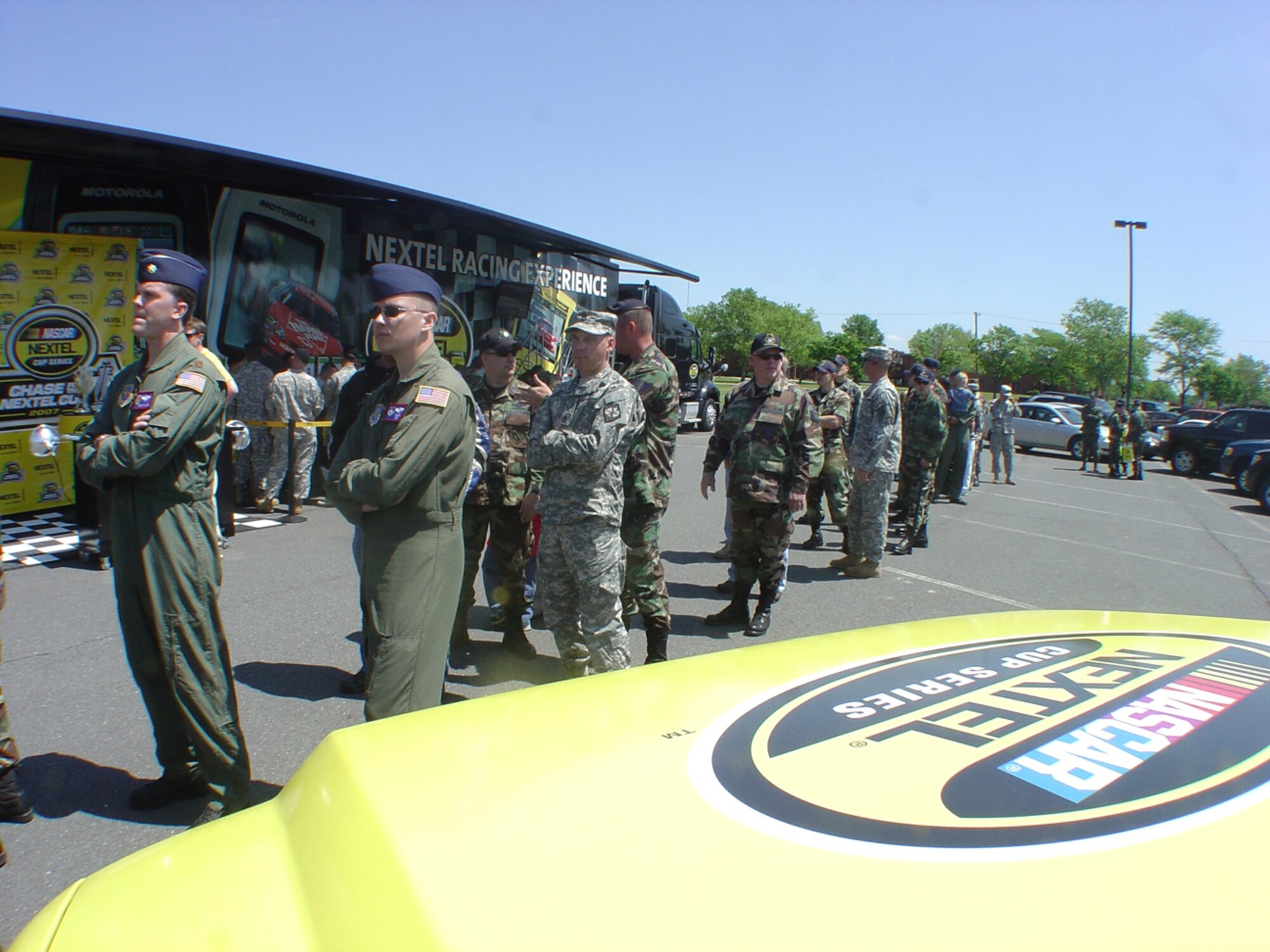 Members of McGuire AFB, Fort Dix and Naval Air Engineering Station Lakehurst line up to receive more than $150,000 of free Pocono 500 NASCAR tickets during the 305th Services Squadron NASCAR Race Car Experience and Pocono 500 Ticket Giveaway held May 21 in The Club parking lot.