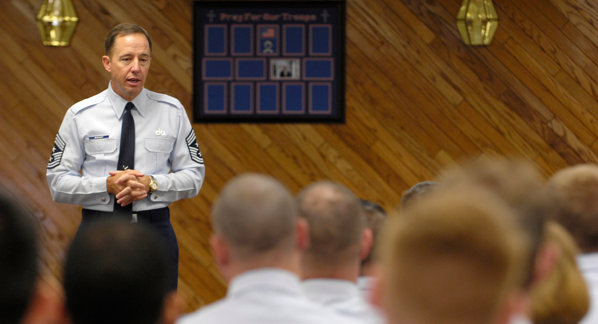 Chief Master Sergeant Anthony Bishop talks with Airman Leadership School and NCO Academy graduates May 16 at Elmendorf Air Force Base, Alaska. Chief Bishop is the command chief master sergeant for Pacific Air Forces. (U.S. Air Force photo/Airman 1st Class Tinese Treadwell) 
