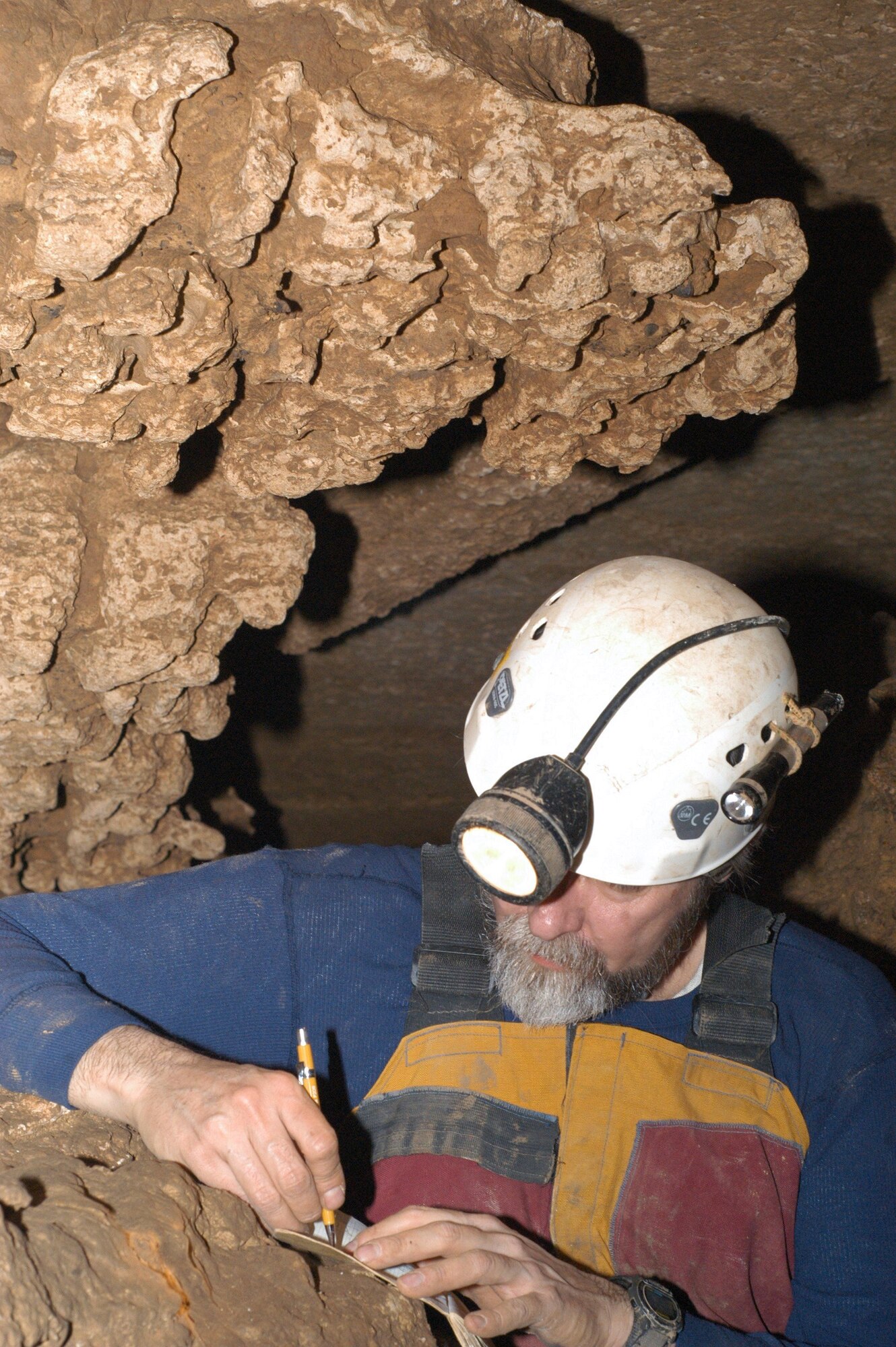 Brian Roebuck makes notes during a mapping and surveying project for the local chapter of the National Speleological Society inside a cave in Maury County, Tenn. Roebuck is an Aerospace Testing Alliance (ATA) engineer at the Arnold Engineering Development Center, Arnold Air Force Base, Tenn. ATA is the support contractor for the base. (Photo by Lynn Roebuck)