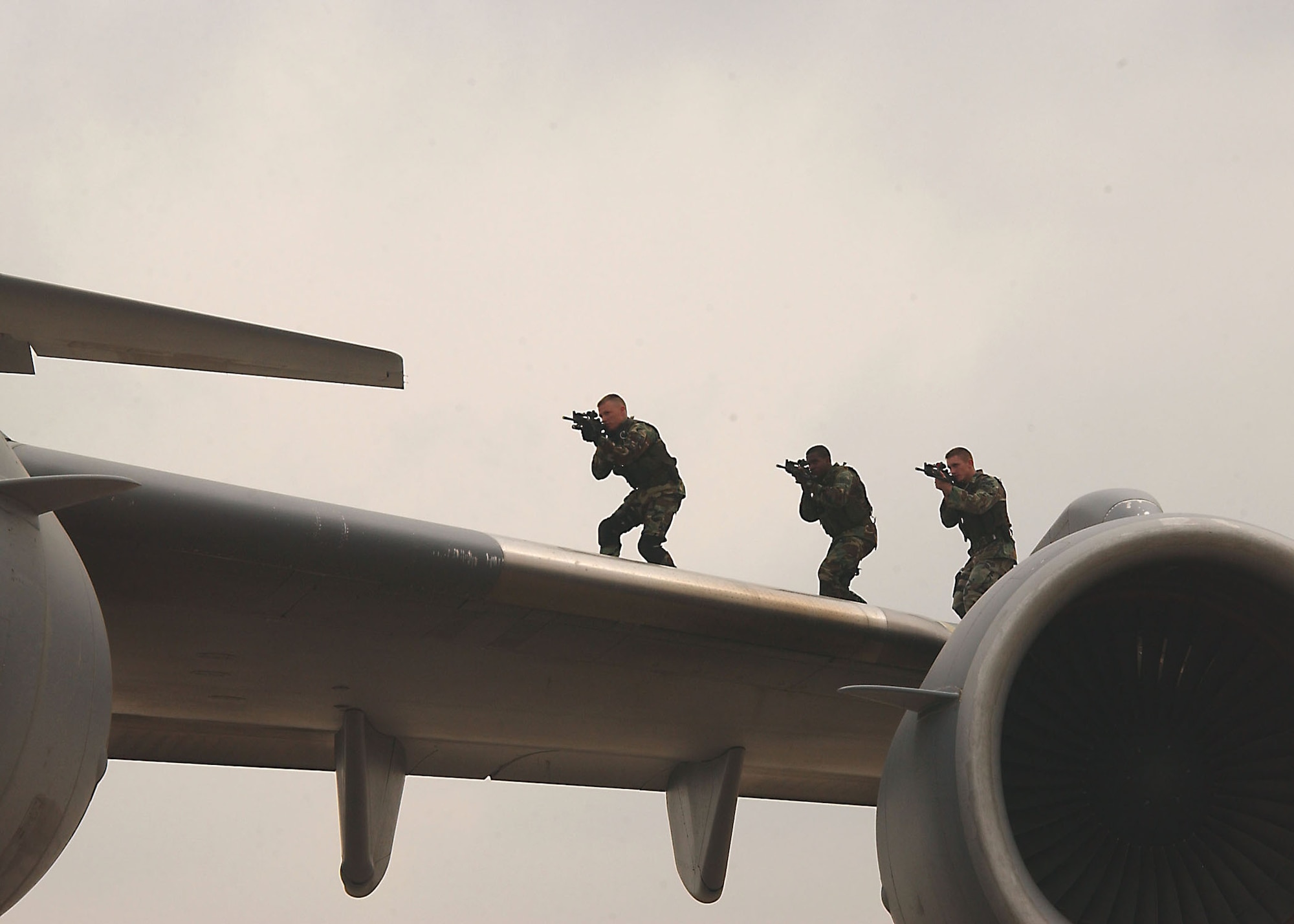 From left to right: Airman 1st Class Jeffrey Lucas and Senior Airmen Nealon Joseph and John Wilkerson, 39th Security Forces Squadron Emergency Services Team members, practice being effective “Wingmen” as they respond to a C-17 recapture exercise May 18. The 39th SFS exercised response capabilities for both vehicle and aircraft recapture scenarios for Brig. Gen. Mary Kay Hertog, Air Force Security Forces director, May 17-19, as she toured Incirlik Air Base. (U.S. Air Force photo by Technical Sergeant Patrick Hyde)