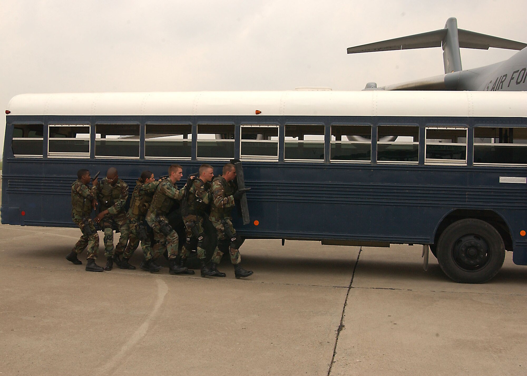 From left to right: Senior Airman Nealon Joseph, Airman 1st Class Chip Perkins, Airman 1st Class Christine Berrios, Senior Airman John Wilkerson, Airman 1st Class Jeffrey Lucas and Senior Airman Jeffrey Peppeard, 39th Security Forces Squadron Emergency Services Team members, conduct a bus sweep during a recapture exercise May 18. The 39th SFS exercised response capabilities for both vehicle and aircraft recapture scenarios for Brig. Gen. Mary Kay Hertog, Air Force Security Forces director, May 17-19, as she toured Incirlik Air Base. (U.S. Air Force photo by Technical Sergeant Patrick Hyde)