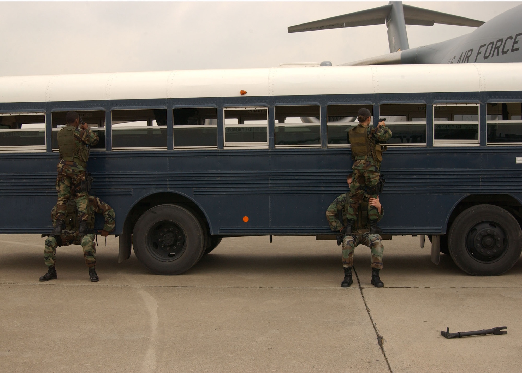 Senior Airman Nealon Joseph (top left), Airman 1st Class Chip Perkins (bottom left), Airman 1st Class Christine Berrios (top right) and Senior Airman John Wilkerson (bottom right), 39th Security Forces Squadron Emergency Services Team members, search a bus during a recapture demonstration May 18. The 39th SFS exercised response capabilities for Brig. Gen. Mary Kay Hertog, Air Force Security Forces director, May 17-19, as she toured Incirlik Air Base. (U.S. Air Force photo by Technical Sergeant Patrick Hyde)
