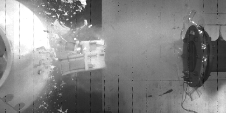 Still photo of a space shuttle block foam impact test on the shuttle’s bipod area at speeds up to 2,255 feet per second was performed at the Air Force’s Arnold Engineering Development Center’s Ballistic Impact Range S-3.
