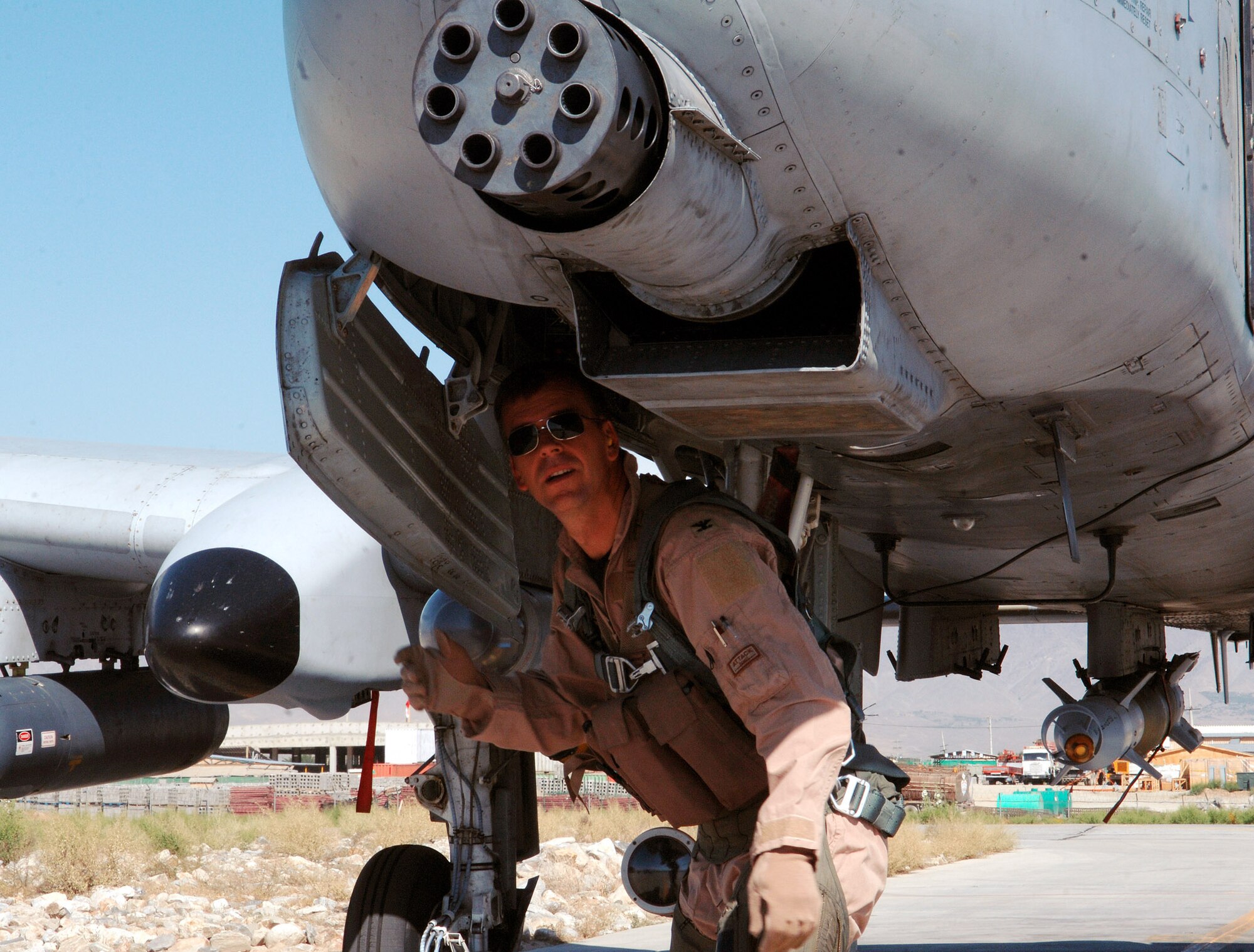 Col. Bruce McClintock, 455th Air Expeditionary Wing vice commander, performs a pre-flight inspection of his A-10 Warthog prior to his flight at Bagram Airfield, Afghanistan May 23. Col. McClintock is deployed from Davis-Monthan Air Force Base, Ariz. (photo by Staff Sgt. Craig Seals)