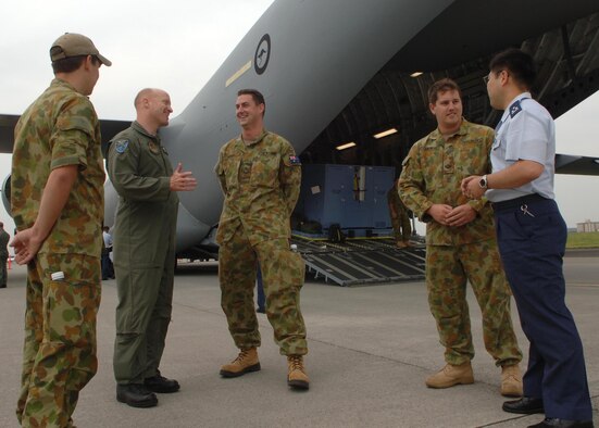 Personnel from teh United States Air FOrce, Royal Australian AIr Force and Japan Air Self Defense Force discuss air mobility operations during the Pacific Global AIr Mobility Seminar. ( U.S. Air Force photo by Senior Airman Veronica Pierce VIRIN 070518-F-3177P-033)