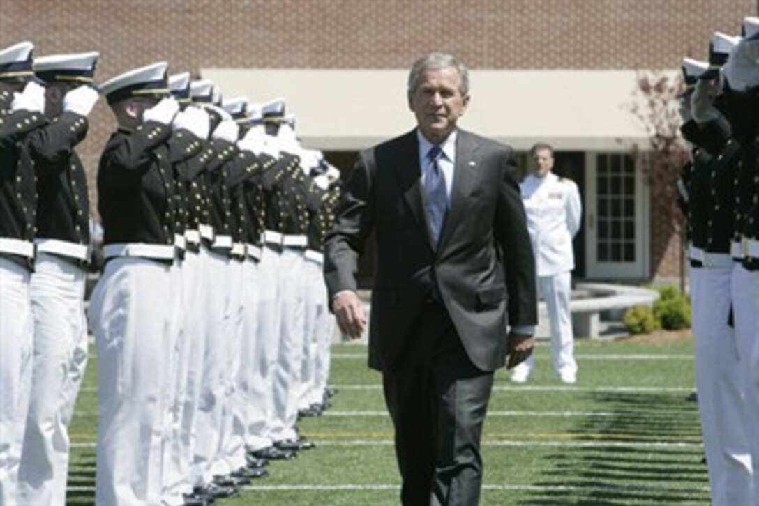 An honor cordon of U.S. Coast Guard cadets salutes President George W. Bush on his arrival to address the graduates at the U.S. Coast Guard Academy commencement in New London, Conn., May 23, 2007.