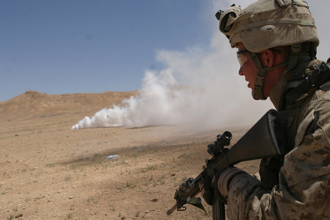 Lance Cpl. Sean A. Griffith, a team leader from Company G, Battalion Landing Team 2/2, 26th Marine Expeditionary Unit, looks down range during a platoon attack at a range in the Middle East, May 24, 2007.  Companies G and E spent several days training alongside regional forces as part of a bilateral exercise.  (Official USMC photo by Cpl. Jeremy Ross) (Released)