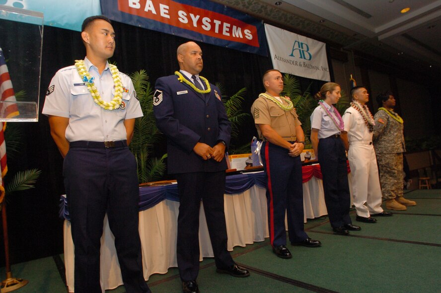 HONOLULU, Hawaii -- Members from each branch of service were presented a Community Service Award for Excellence in Community Outreach here by the Honolulu Chamber of Commerce, at this year's 22nd annual Military Appreciation Month Luncheon.  Members are (left to right) Hawaii National Guard Senior Airman Ryan Young, U.S. Air Force Master Sergeant Thomas Yaron, U.S. Marine Corps Staff Sergeant Crystal Havey, U.S. Coast Guard Marine Science Technician First Class Elizabeth Yeager, U.S. Navy Petty Officer Diem Ngo, and U.S. Army Sergeant First Class Sharlinda Warner.  (Air Force photo by Angela Elbern)