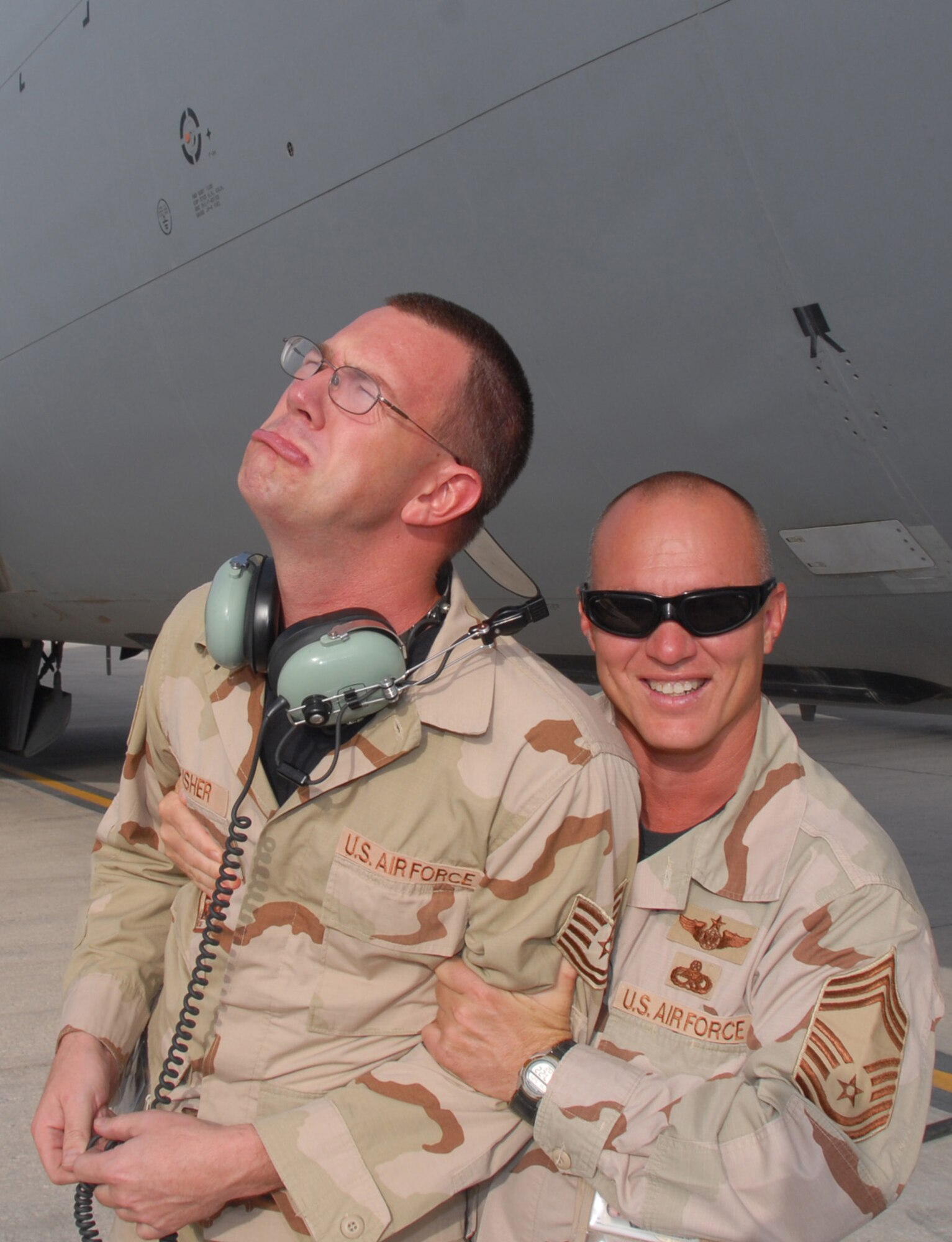 "Thirty more days - extra - huh?" -- Tech. Sgt. John Slusher and Chief Master Sgt. Doolittle, both 22nd Aircraft Maintenance Squadron. (Photo by Master Sgt. Bobby Burgess)