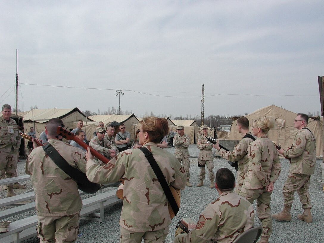 Night Wing, the popular music group from the USAF Heartland of America Band, performs for deployed members of the United States Army deployed to Manas AB, Kyrgyzstan.
