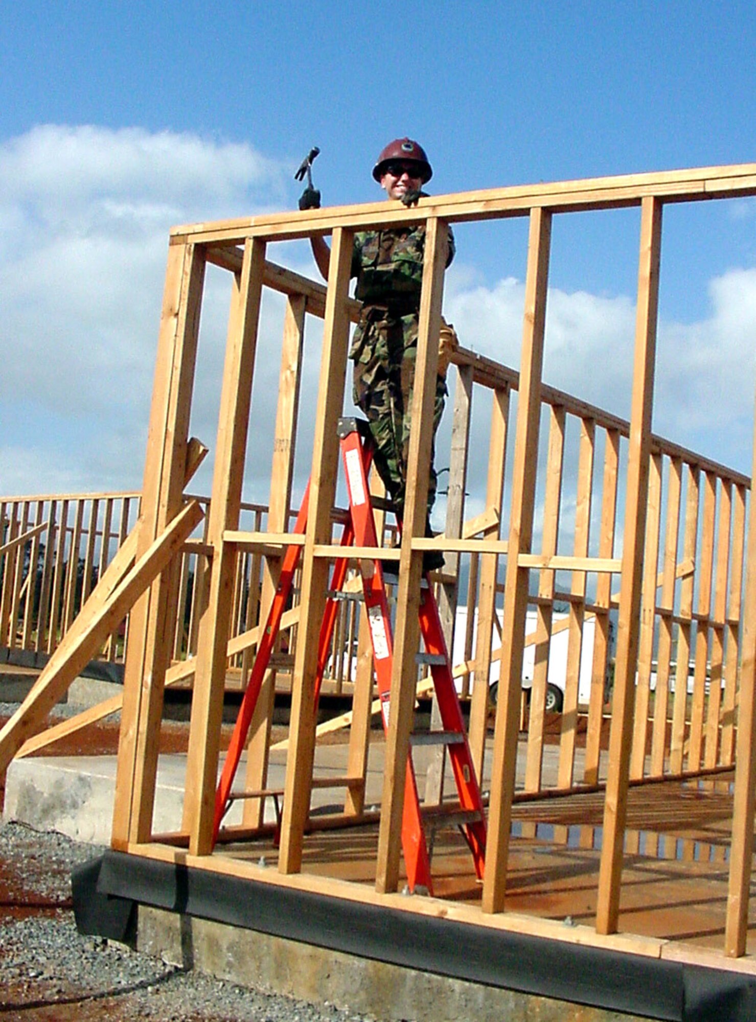 Airman 1st Class Danielle Klitzke assists with building exterior walls on an adult daycare center in Oahu, Hawaii. The reservist is assigned to the 440th Airlift Wing based at General Mitchell Air Reserve Station in Milwaukee. Forty-four reservists from the 440th Civil Engineer Squadron deployed on the humanitarian mission to Hawaii. Airman Klitzke is a plumber with the 440th CES. (U.S. Air Force photo/Maj. Gwen Sheppard)
