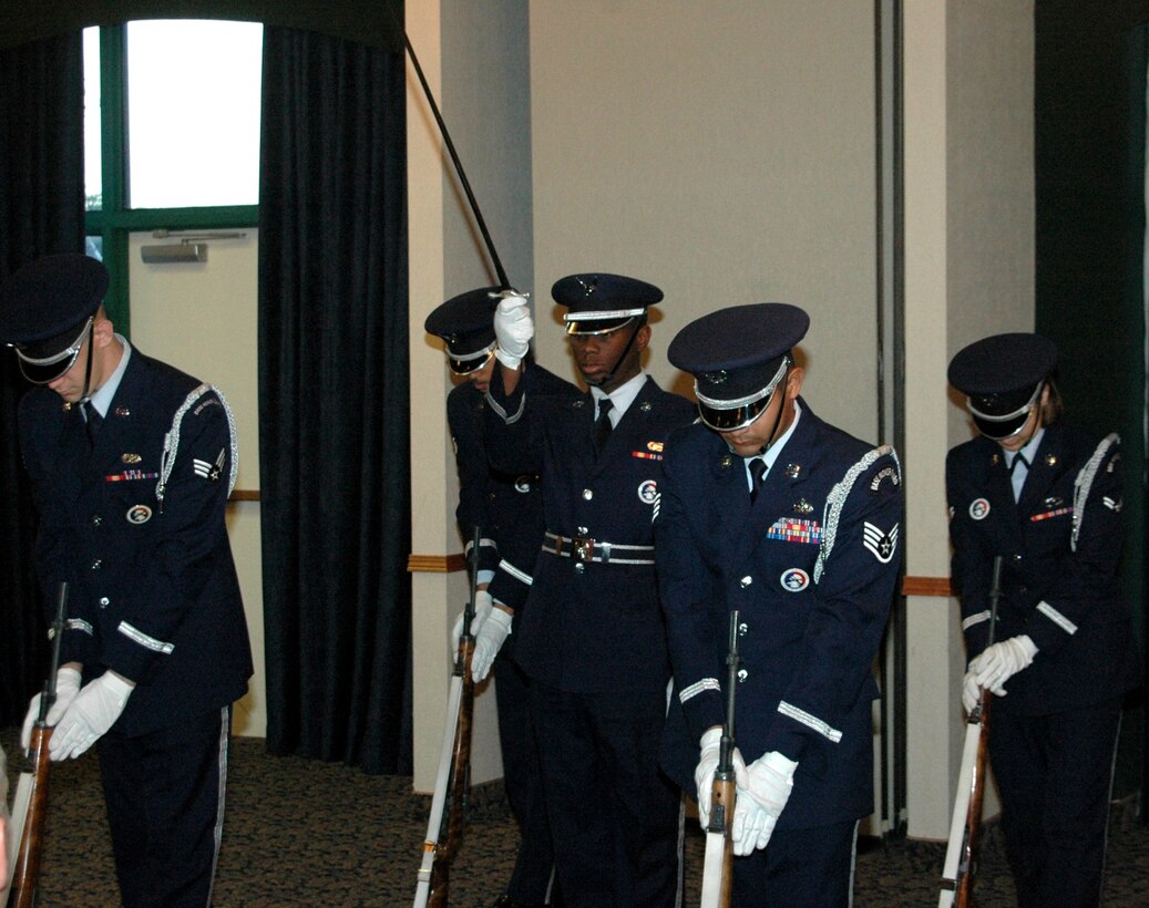 Members of the 28th Bomb Wing honor guard exhibition drill team perform for Col. Jeffry Smith, 28th Bomb Wing commander, during a farewell dinner held at the Dakotas club here May 19.  Col. Smith will depart for the Pentagon as Col. Scott Vander Hamm will assume command of the 28th Bomb Wing in a June 1 change of commander ceremony. (U.S. Air Force photo/Tech. Sgt. Todd Wivell)