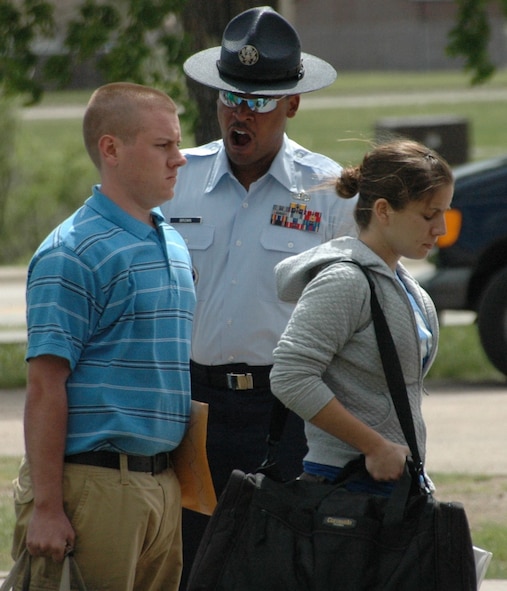 Tech. Sgt. Anthony Brown, military training instructor,  welcomes the Reserve Officer Training Corps cadets upon their arrival to Ellsworth May 24. Sergeant Brown, here from Lackland Air Force Base, Texas, will assist cadets to complete the only congressionally-mandated portion of their training. As the first of three ROTC encampments, this group will be at Ellsworth through June 21. (U.S. Air Force photo/Airman 1st Class Kimberly Moore Limrick)