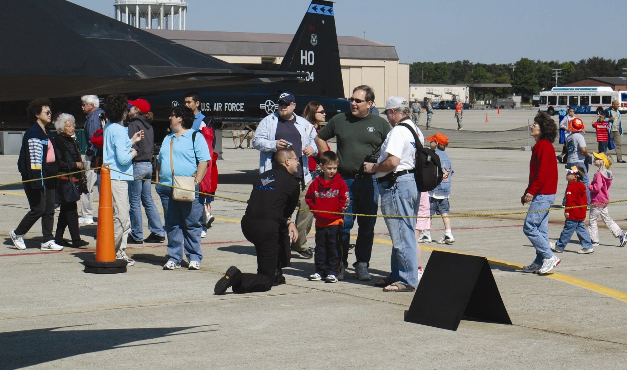 Tech. Sgt. Nathan Know, F-117 Demonstration Team superintendent, shares information about the Nighthawk with a family during the Joint Services Open House, held at Andrews Air Force Base, Md., May 18-20. (U.S. Air Force photo by 1st Lt. Phil Ventura)
