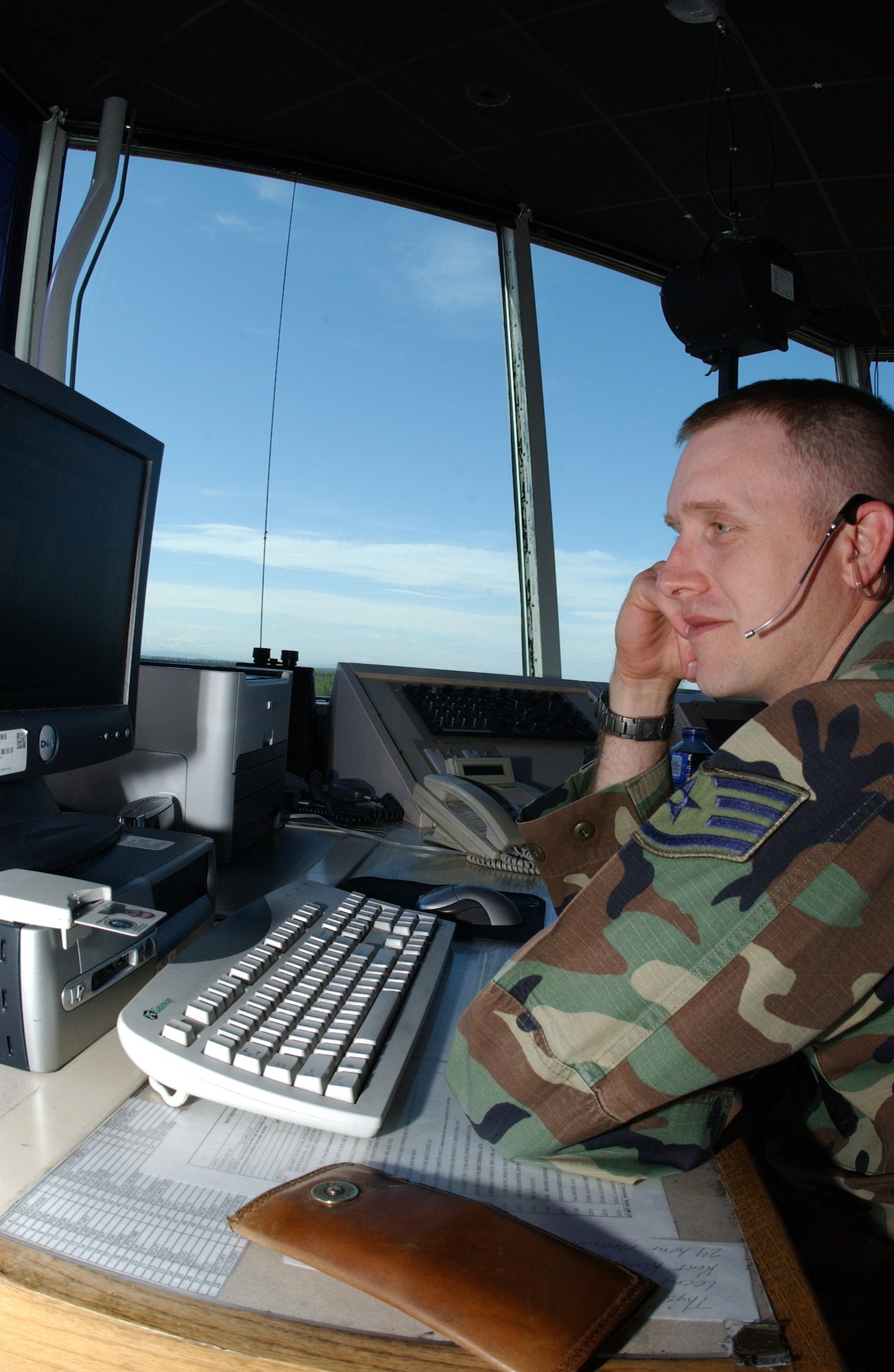 EIELSON AIR FORCE BASE, Alaska --   Staff Sgt. Jeremy Garrett, 354th Operations Support Squadron air traffic controller, checks the weather forecast May 23 in the air traffic control tower. Sergeant Garrett says during periods where there are no exercises they have on average 10 to 15 planes take off on the flightline every day with the work day split into two shifts from 7 a.m. to 10 p.m. and on-call 24 hours a day to report at a moment's notice. (U.S. Air Force photo by Airman 1st Class Christopher Griffin)
