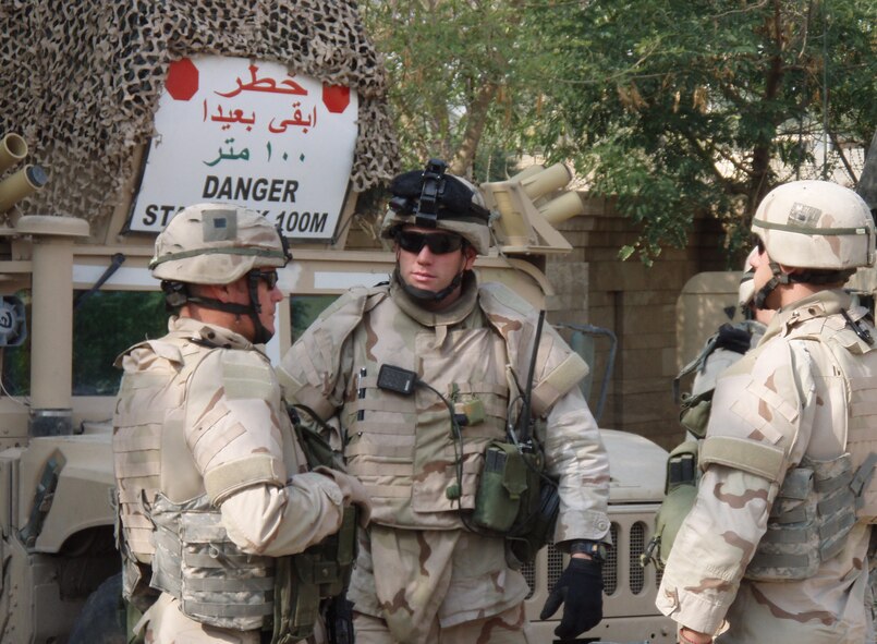 Tech. Sgt. William Duffy, Staff Sgt. Justin Geers and Staff Sgt. James Arent, 824th Security Forces Squadron, discuss a recent patrol during their last deployment in Iraq. The 824th SFS was the first Air Force security forces unit tasked to train Iraqi Police in downtown Baghdad.  The squadron’s efforts earned it the honor of best medium sized security forces squadron in the Air Force for 2006. (U.S. Air Force courtesy photo)