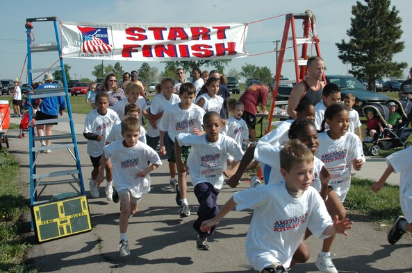 Children ages 5 through 13 start their portion of the Americas Kids Run held at the Heritage Lake track May 19. More than 30 children participated in this years event. (U.S. Air Force photo/Tech. Sgt. Todd Wivell)