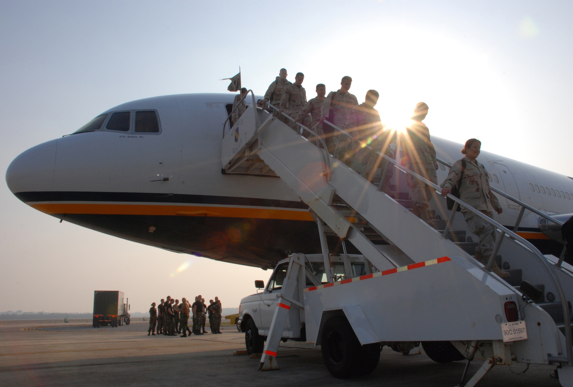 EGLIN AIR FORCE BASE, Fla. -- Airmen of the 728th Air Control Squadron step of a plane to end their journey home May 24 from a deployment to Southwest Asia. Family members gathered in front of the squadron as more than 175 members of the 728th ACS, the Demons, returned home from a deployment to Southwest Asia in support of Operation Iraqi Freedom. The 728th ACS mission encompasses the widest variety of Air Force careers, affording it global reach and the ability to complete its mission anywhere needed. The Airmen spent the last five months in Iraq controlling and monitoring Iraqi airspace, assisting in providing close air support for troops in conflict and reconnaissance and directing tanker traffic for refueling efforts. The squadron has spent nine of the past 12 months deployed. (U.S. Air Force photo by Staff Sgt. Mike Meares)