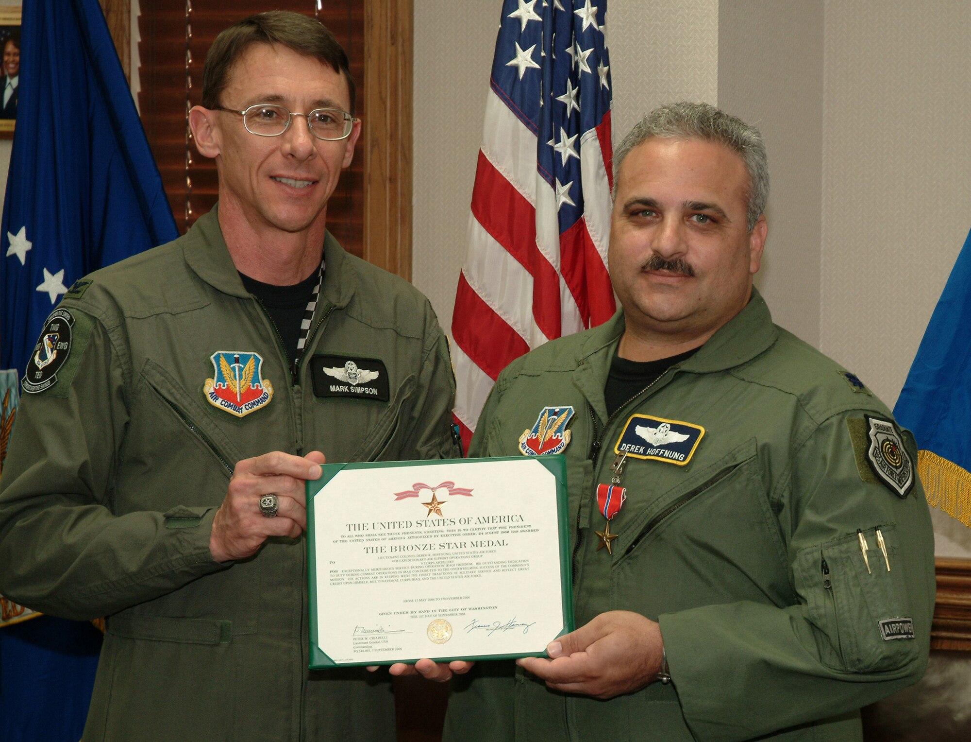 EGLIN AIR FORCE BASE, Fla. -- Lieutenant Colonel Derek Hoffnung, 28th Test and Evaluation Squadron, was awarded a Bronze Star for his exceptional actions while deployed to Camp Victory, Baghdad, Iraq from May to Nov. 2006. While at Camp Victory he served as the commander of the 704th Expeditionary Support Squadron, Multi-National Corps-Iraq in support of Operation IRAQI FREEDOM. He led a team in providing effective support to more than 70 Tactical Air Control Parties, Combat Weather Teams and Remote Weather Stations at 78 locations in Qatar, Kuwait, Iraq and Afghanistan. Col. Mark Simpson, 53d Wing vice commander, presented the award to Colonel Hoffnung at a recent staff meeting. (U.S. Air Force photo/Tech. Sgt. Andrew Leonhard)
