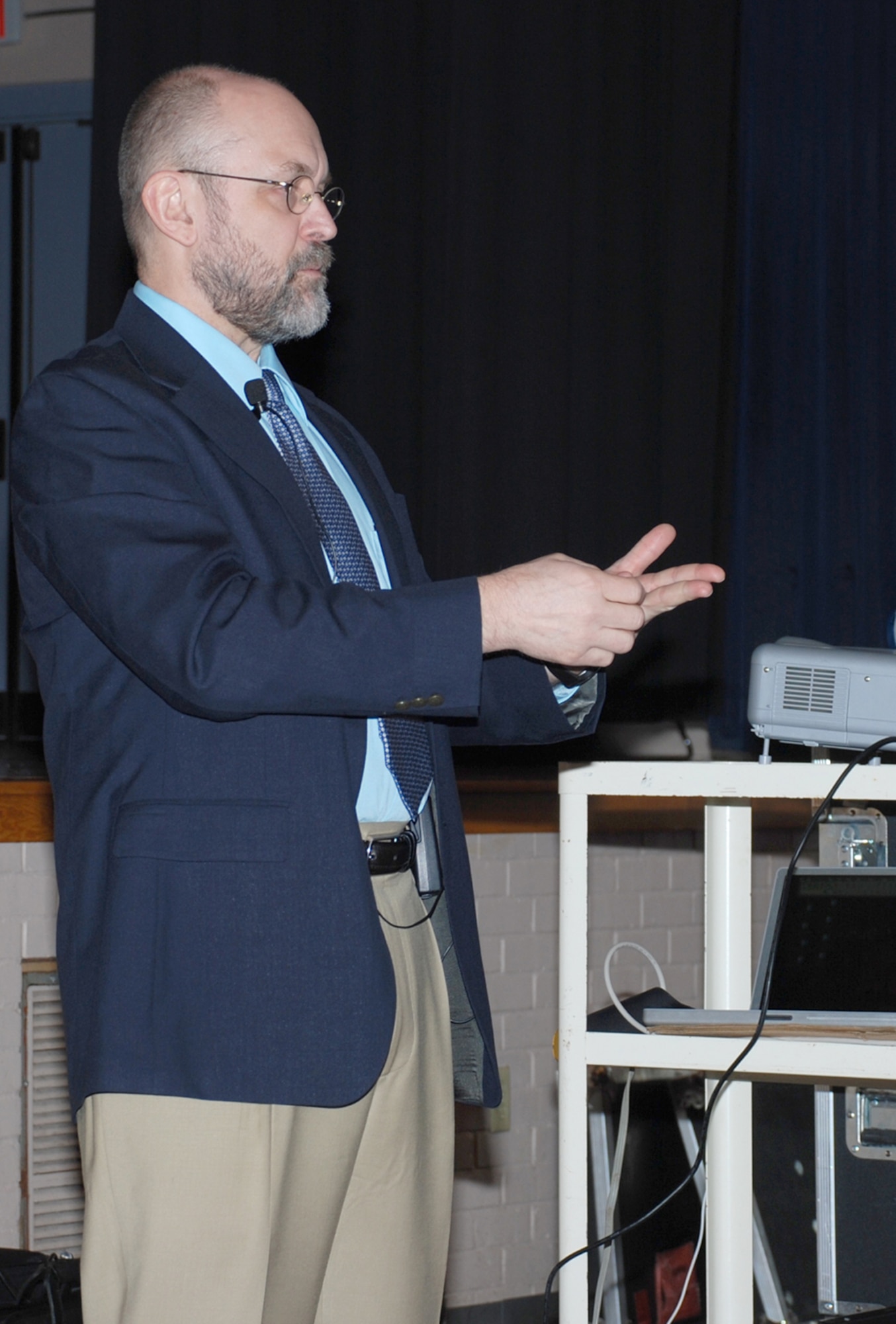Dr. Don Conway-Long, a professor from Webster University, talks to Team McConnell members about Islam, the religious faith of Muslims and development of Muslim culture during the education center’s Guest Speaker Series, May 18 at the base theater. He talks about the difference between Islam and radical Islam. He also discusses the longstanding religious differences and difficulties between the Shi’a and Sunni Muslims and focused on the impact these cultures have on America and other allied troops serving in the middle-east region. The series is open to all McConnell personnel and will feature several speakers over the next four months from different universities and learning institution around Wichita. The next presenter in the series is Dr. J.A. Sheppard, from Southwest College, who will present “Religion and War: When religion and politics are the same.” The presentation is scheduled for June 22 from 3-4 p.m. in the Dole Center ballroom. (Photo by Airman 1st Class Jessica Lockoski)