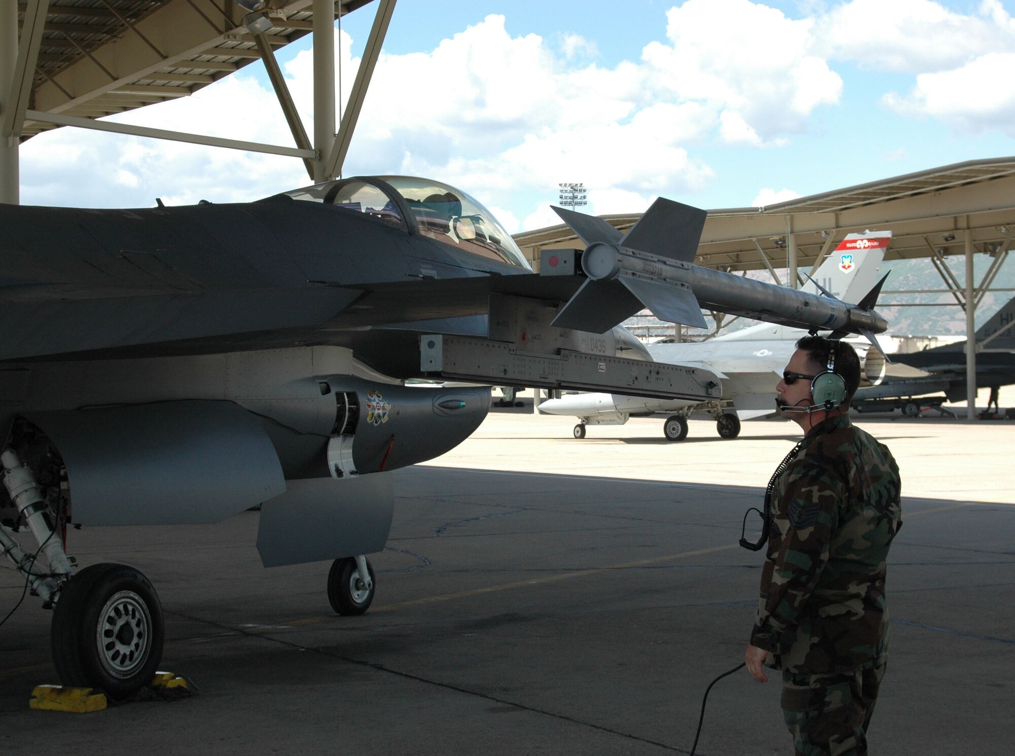 Technical Sgt. Matt Bennato, an Air Reserve Technician with the 419th Fighter Wing, prepares to launch a 34 Fighter Squadron F-16 May 23.  This is the second day Reserve aircraft maintenance Airmen have worked beside active duty Airmen in the 34th Aircraft Maintenance Unit. (U.S. Air Force photo by 2nd Lt. Beth Woodward)