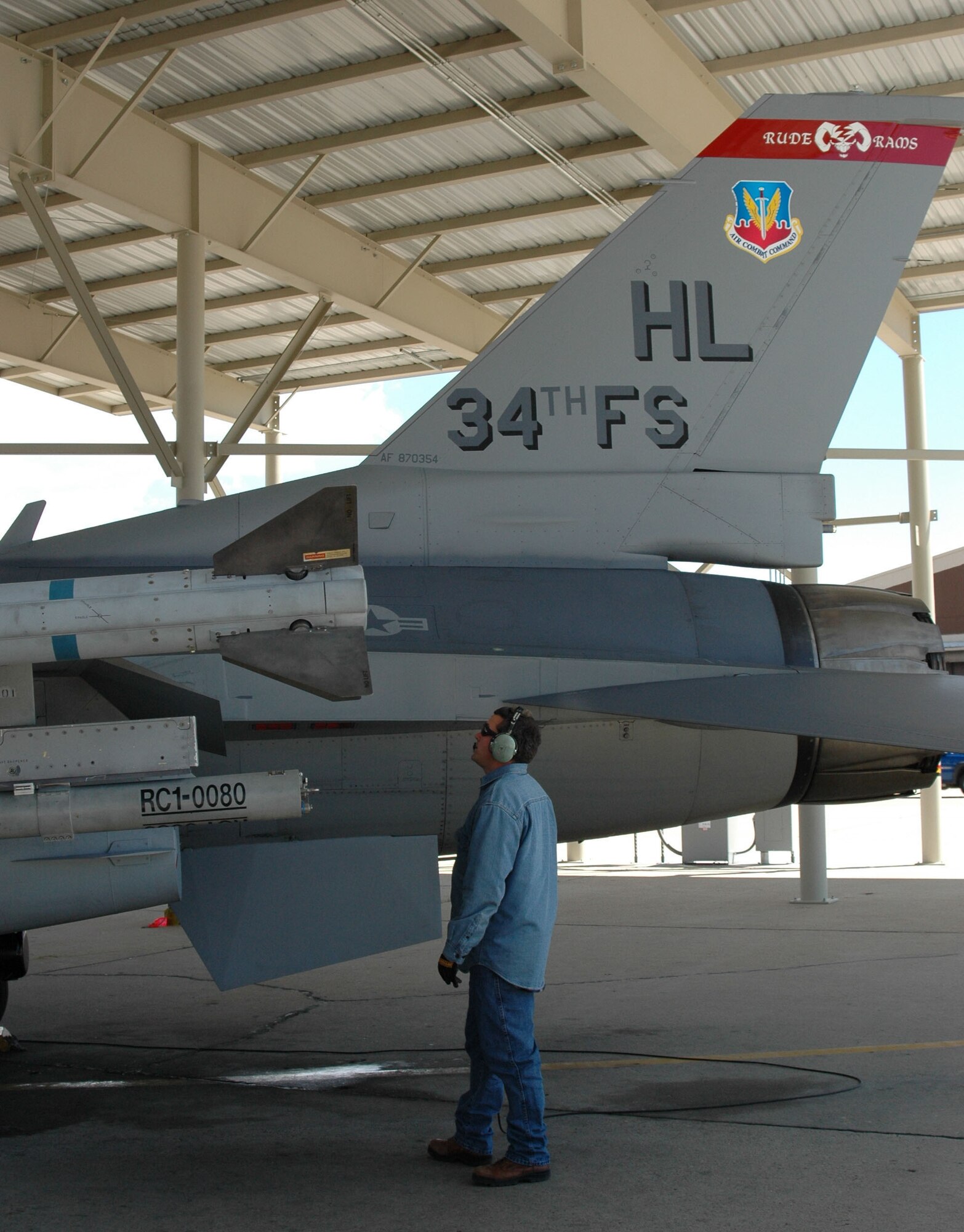 James Lafeen, a 419th Fighter Wing Air Reserve Technician and crew chief, inspects an active duty F-16 prior to take-off May 23.  Mr. Lafeen joined the Reserves in 1990 after serving three years on active duty.  The Reserve and active duty fighter wings at Hill are associating under Total Force Integration. (U.S. Air Force photo by 2nd Lt. Beth Woodward)