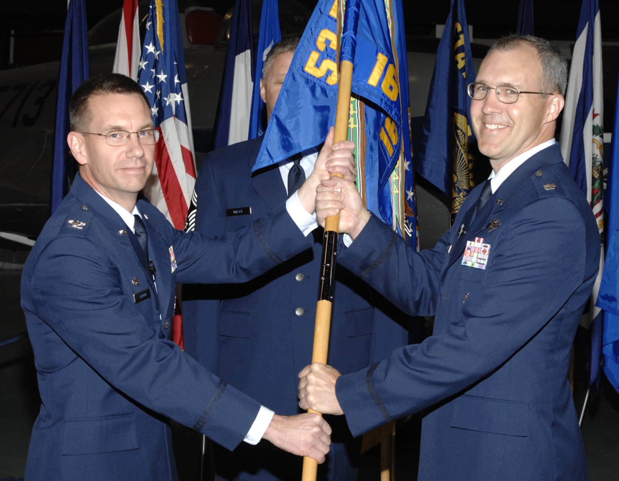 EGLIN AIR FORCE BASE Fla. – Lt. Col. Dean King, 16th Electronic Warfare Squadron commander, accepts the squadron guidon from Col. Gregory Dragoo, 53d Electronic Warfare Group commander, during a Change of Command ceremony May 18 at the Air Armament Museum. Colonel Dean was previously the director of operations for the 68 EWS and took over as commander from Lt. Col. Mark Colbert. (Photo provided by Indyne Inc.)