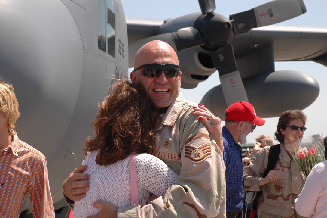 NIAGARA FALLS AIR RESERVE STATION, NEW YORK- Staff Sgt. James Barrile, 914th ASTS,  Medical Technician gets a big welcome home hug from his wife. Barrile was amoung 26 reservists who were stationed at Balad Air Base, Iraq supporting Operation Iraqi Freedom. (U.S. Air Force Reserve Photo/ Master Sergeant Paul Brundage) 