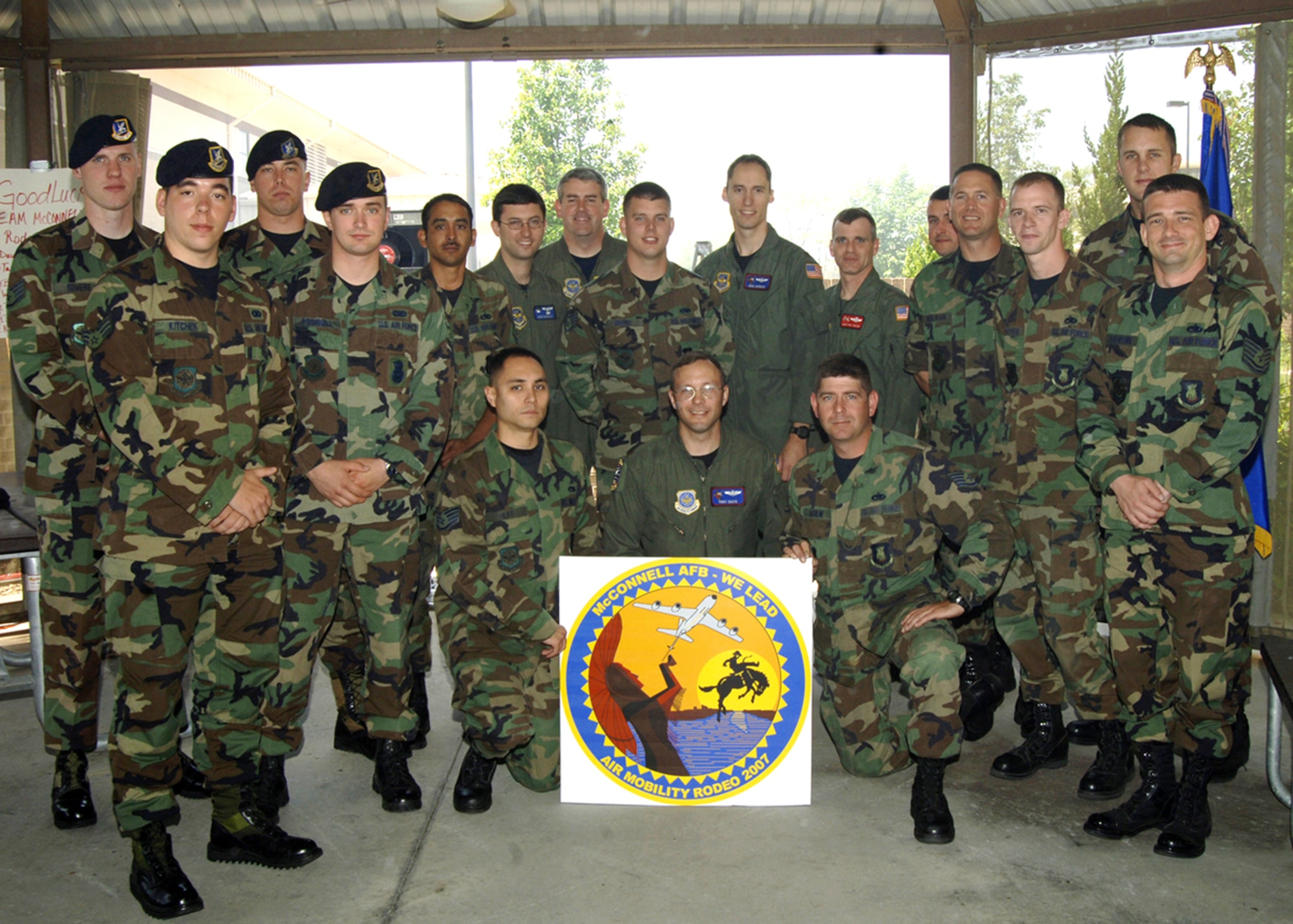 The 2007 McConnell Team players gather at the Rodeo kickoff picnic May 18 at the 931st  Air Refueling Group pavilion. Tech. Sgt. Darryl Dauphin, 22nd Aircraft Maintenance Squadron, (standing far right), is the winner of the Rodeo logo/patch design. His design will be worn by McConnell participants at the 2007 Air Mobility Command Rodeo, July 22 -28, at McCord Air Force Base, Wash. (Photo by Airman 1st Class Laura Suttles)