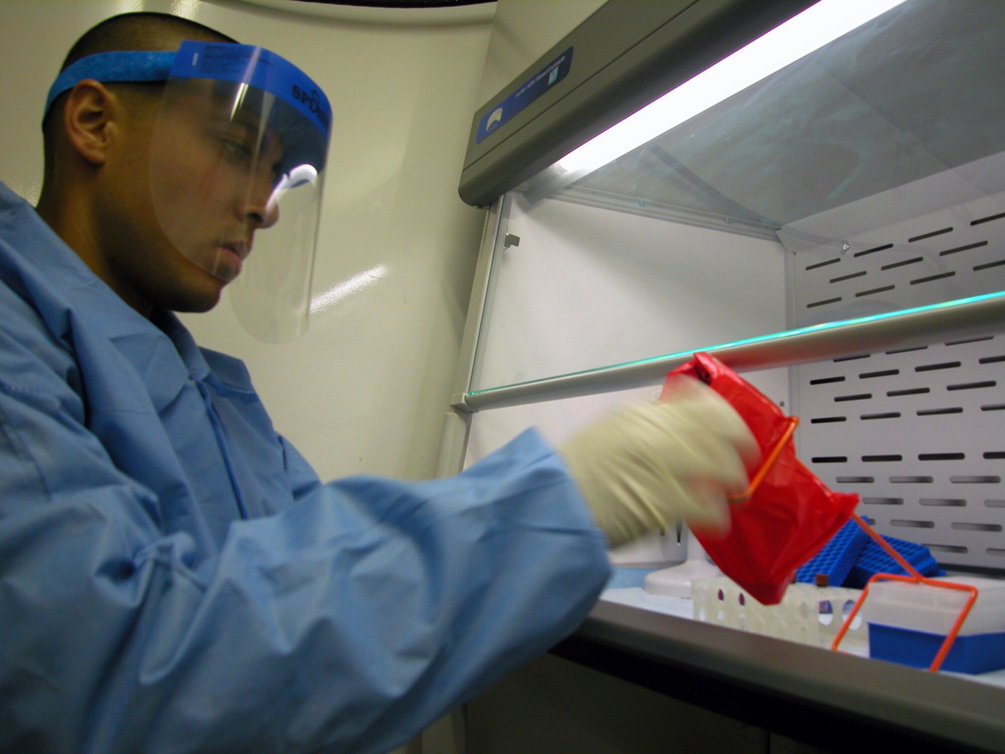 Staff Sgt. Raul Gutierrez sets up a test in the biological augmentation team lab May 11 at Balad Air Base, Iraq. Sergeant Gutierrez is deployed from the Air Force Institute of Operational Health, part of the 311th Human Systems Wing at Brooks-City Base in San Antonio. Sergeant Gutierrez is a a lab technician with the 332nd Expeditionary Medical Group's biological augmentation team. (U.S. Air Force photo/Master Sgt. Bryan Ripple) 
