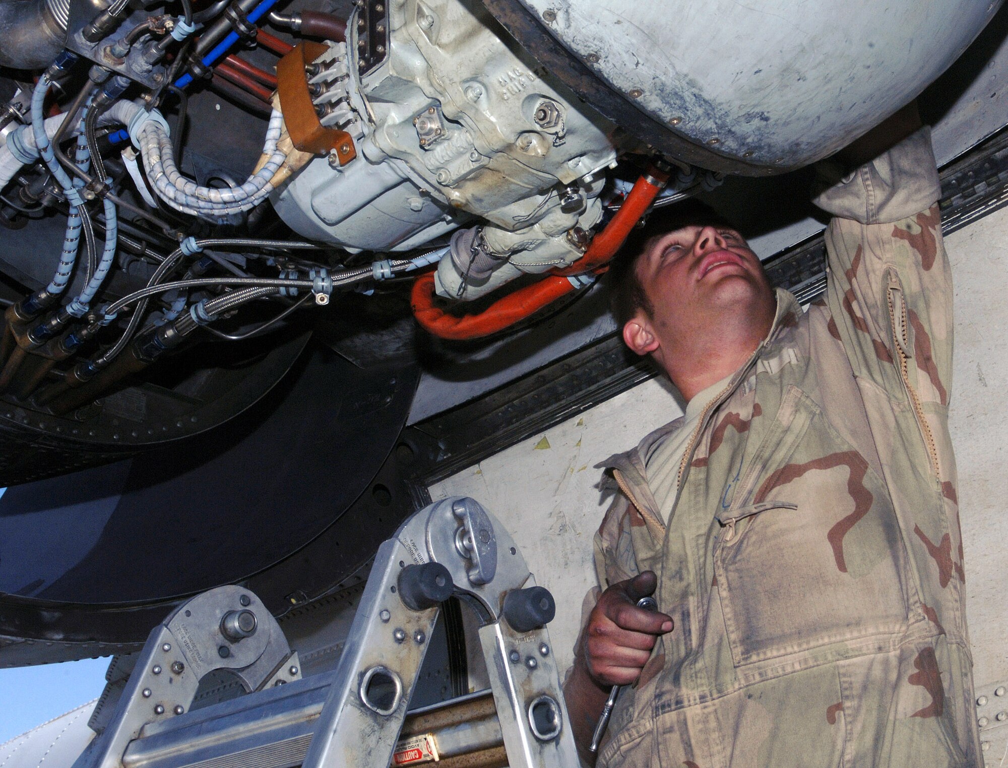 Staff Sgt. James Stage, 354th Expeditionary Aircraft Maintenance Unit propulsion technician, prepares to swap out the engine of an A-10 Warthog at Bagram Airfield, Afghanistan May 24. Sergeant Stage is deployed from Davis-Monthan Air Force Base, Ariz. (photo by Staff Sgt. Craig Seals)