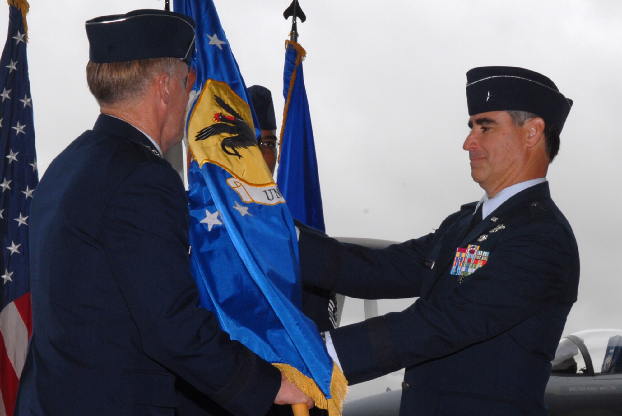 Brig. Gen. Punch Moulton relinquishes command of the 18th Wing to Lt. Gen Bruce Wright, U.S. Forces Japan commander, during a change of command ceremony May 24 at Kadena Air Base, Okinawa. Brig. Gen. Brett Williams assumed command of the wing later during the ceremony.
(U.S. Air Force/Senior Airman Jeremy McGuffin)