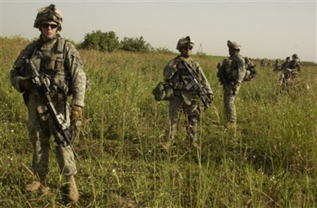 U.S. Army soldiers conduct a foot patrol in Yusufiyah, Iraq, to locate three missing soldiers on May 20, 2007.  The soldiers are assigned to Charlie Company, 4th Battalion, 31st Infantry Regiment, 2nd Brigade Combat Team, 10th Mountain Division (Light Infantry).  