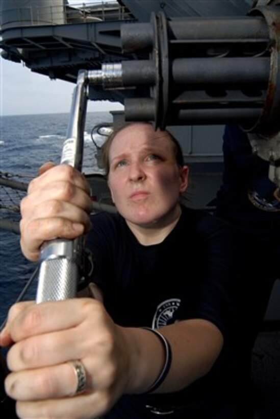 U.S. Navy Petty Officer 3rd Class Geneva Myers ensures that the barrels of the Phalanx close-in weapons system are tight as part of a pre-fire inspection on the port fantail mount aboard the Nimitz-class aircraft carrier USS John C. Stennis (CVN 74) underway in the Arabian Sea on May 17, 2007.  The Phalanx is one of the Stennis' self defense systems used to combat close-in air or surface threats.  